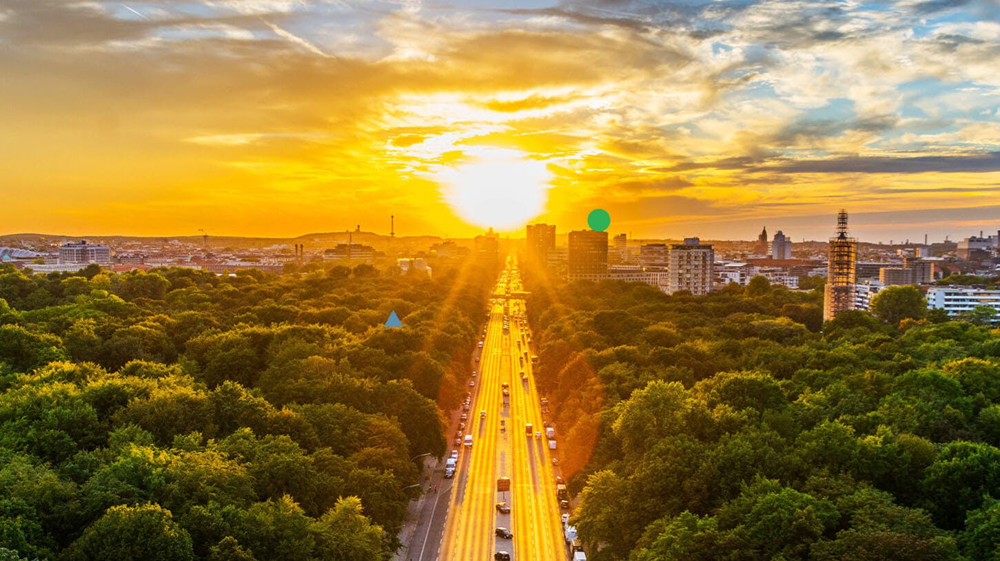 Image shows sunset over a city and motorway. This article explains our thematic portfolio range, why we launched thematic portfolios, which themes are available and how our thematic portfolios work.